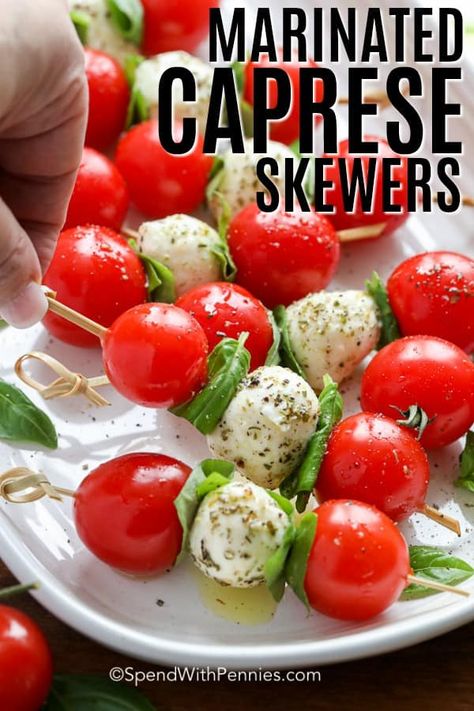 Caprese skewers are a tasty combination of cherry tomatoes, mozzarella balls, and fresh basil, then drizzled with a balsamic glaze. They are the perfect mini appetizer to serve at your next party or gathering. #spendwithpennies #capreseskewers #caprese #appetizer #miniappetizer Mozzarella Appetizers, Tomato Skewers, Caprese Appetizer, Caprese Salad Skewers, Tomato Appetizers, Marinated Cheese, Ensalada Caprese, Mozzarella Balls, Skewer Appetizers