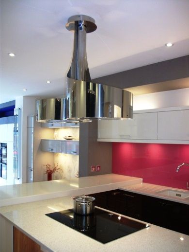 The shiny flowing lines of the Double Vertigo cooker hood from BEST - displayed at In-toto Kitchens in Wokingham. Modern Kitchen Hood, Kitchen Hood Ideas, Hood Range, Kitchen Hood Design, Kitchen Extractor, Island Cooker Hoods, Hood Ideas, Kitchen Hood, Hood Design