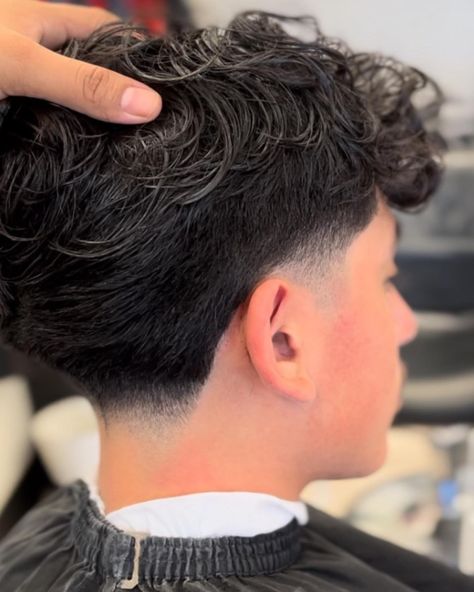 We suggest a low taper fade, a super simple yet impactful hairstyle if you have some edges that need trimming, or want to incorporate a fun, neat twist to your look. Click the article link for more photos and inspiration like this // Photo Credit: Instagram @eleganzebeautysalon // #longhairlowtaperfade #lowtaperfade #lowtaperfadehaircut #menshair #menshaircuts #shortlowtaperfade Fesyen Rambut Lelaki, Low Taper Haircut, Taper Fade Long Hair, Taper Fade Short Hair, Fade Haircut Curly Hair, Low Taper Fade Haircut, Taper Fade Curly Hair, Low Taper Fade, Low Taper