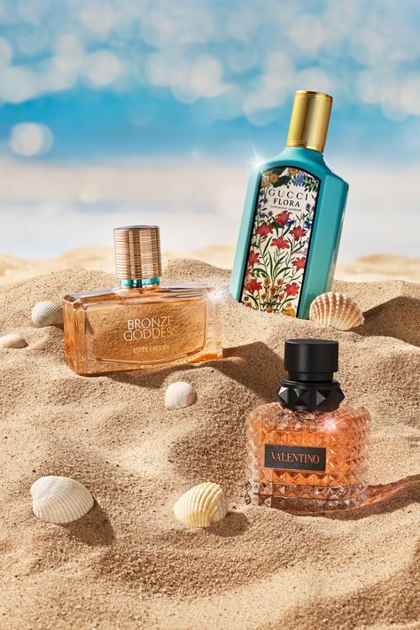 Bottles of perfume in sand photograph surrounded by seashells and sea backdrop Beach Perfume Photography, Luxury Perfume Packaging, Perfume Summer, Beach Perfume, Creative Advertising Photography, Paper Bunny, Fragrance Photography, Summer Perfume, Packaging Template Design