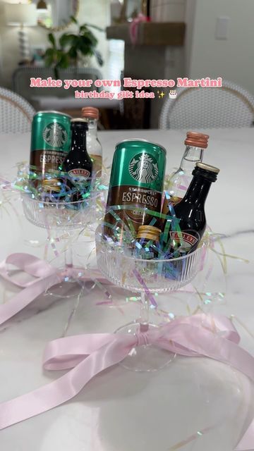 Amber Capps on Instagram: "A make your own espresso martini gift idea✨  I bought a set of coupe glasses from Amazon, tied a ribbon around the bottom of the glass + filled them with irredescent crinkle paper.   I used mini glass bottles and filled them with espresso beans to garnish with, added a can of espresso, mini bottles of vodka and coffee liqueur (I used Bailey’s because it’s the closet I could find in a mini bottle - I would normally use Kahlua ☕️) to each glass.   They were the perfect birthday gift for 2 of my friends who love espresso martinis! (+ so easy to make!)  . . . . . . #espressomartini #espresso #giftideas #giftideasforher #amazongiftideas #amazongiftideas #birthdaygifts #martinicocktail #giftsforher #easygiftideas #coupeglass #amazonfinds" Martini Glass Gift Ideas, Cute Alcohol Gift Ideas, Espresso Gift Basket Ideas, Espresso Martini Gift Ideas, Airplane Bottle Gift Ideas Christmas, Friend 21 Birthday Gift Ideas, Tito’s Gift Ideas, Mini Wine Gift Ideas, Martini Basket Ideas