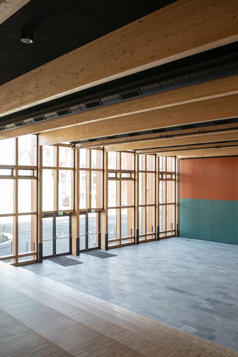 The cultural centre features black Troldtekt line ceilings and stone floors – robust, textural surfaces that perfectly complement the existing brick walls and wooden structures. In the corridor and all the classrooms, white Troldtekt ceilings have been installed to create a better indoor climate. #goodacoustics #holzwolleplatten #träullsplattor #troldtekt | Architects: SWECO architects Sweco Architects, Acoustics Design, Stone Floors, Cultural Centre, Cosy Corner, Brick Walls, Public Building, Wood Windows, Folding Doors