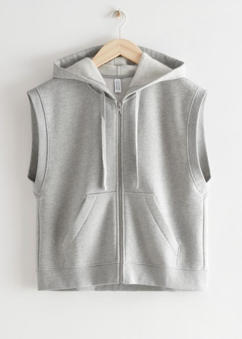 Sleeveless drawstring zip hoodie with a boxy silhouette and duo pockets. Organic cottonRibbed sleeve opening and hemLength of hoodie: 57cm / 22.4" (Size S) Chaleco Casual, Hippie Style Clothing, Women's Sweatshirts, Blazer Fashion, Fashion Story, Print Pullover, Casual Style Outfits, Apparel Design, Women's Tops