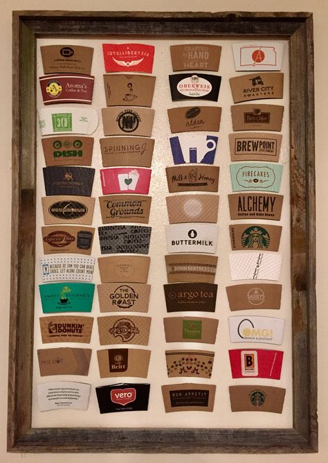 Display coffee sleeves in a frame on the wall  Coffee sleeve collection Biggby Coffee, Espresso Patronum, Coffee Display, Coffee/wine Bar, Cornelia Street, Coffee Cup Art, Cafe Cup, Mug Display, Cup Sleeves