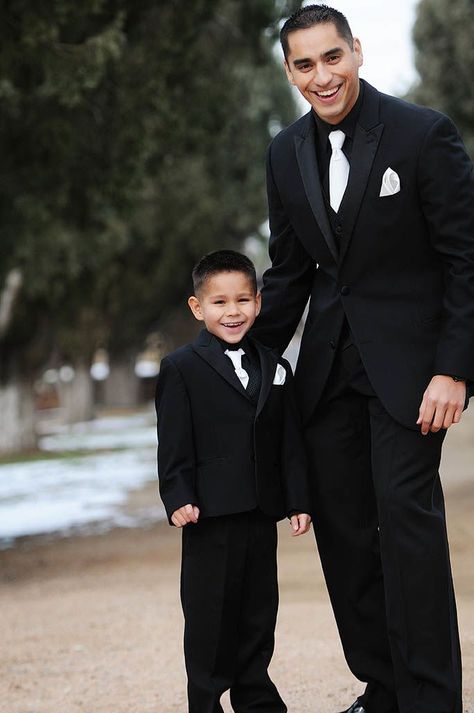 All Black Tux With White Bow Tie, Black And White Ring Bearer Attire, All Black Suit White Tie, All Black Ring Bearer Outfit, Black Tuxedo White Bow Tie, Groom Attire Black And White, Black Tux White Tie, Black Suit White Tie, Black On Black Tux