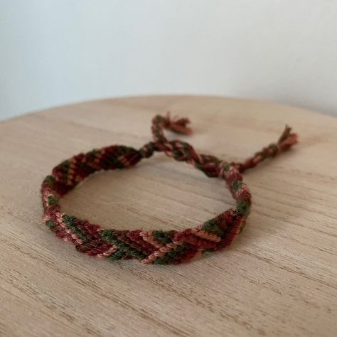 A Handmade Bracelet Woven With Red, Green, And Brown Colors. 10 Bracelets For $25. Red Jasper Bracelet, Bracelet Colors, Colorful Bead Bracelets, Yarn Bracelets, Fall Evening, Autumn Bracelet, Thread Bracelet, Knit Bracelet, Diy Bracelets Tutorials