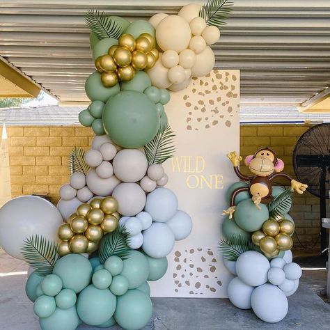 Shimmer & Confetti on Instagram: "W I L D O N E 🌿🦒✨ Gorgeous party setup by @izzyb.balloons for a 1st birthday party! . . . #shimmerandconfetti #inspo #pastel #safariparty #kidsfashion #kidspartyideas #kidspartydecor #kidsparty #kidspartyplanner #stylist #eventstylist #jungleparty #1stbirthdayideas #wildone #littlemonkey" Safari Balloon Decor, Wild One Birthday Balloons, Monkey Birthday Party Decorations, Monkey Birthday Theme, Wild One Balloons, Safari Balloon Decorations, Monkey Themed Birthday Party, Baby Shower Monkey, Safari Baby Shower Boy