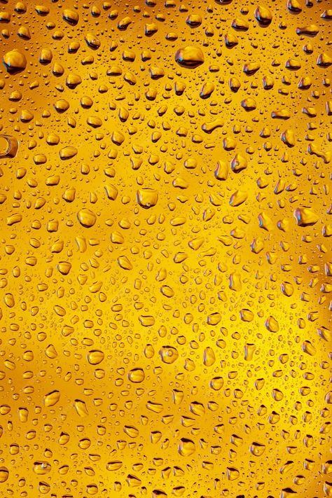 Premium Photo | Close up view of cold drops on the glass of beer background. texture of cooling alcohol drink with macro bubbles on the glass wall. fizzing or floating up to top of surface. golden colored. Bubbles Texture, Alcohol Background, Beer Background, Camouflage Pattern Design, Bubble Texture, Glass Of Beer, Lemon Twist, Yellow Textures, Motion Graphics Design