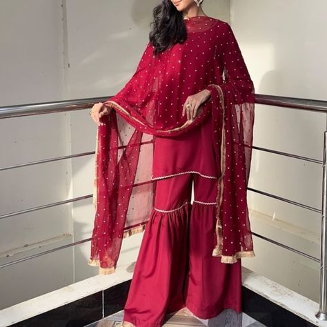 Embrace elegance with this stunning deep red shirt paired with gharara pants and a traditional dupatta adorned with exquisite jhalar lace. Perfect for any festival or wedding occasion! 3 piece stitched dress is available in our store. DM for order/details @xarnish_store #xarnish #inspo #instadaily #india #indianwedding #indianbride #indianwear #indianfashion #pakistanifashion #pakistaniwedding #pakistaniclothes #pakistanidress #pakistanisuits #ethnicwear #casualchic #casual #cotton #cloth... Types Of Sharara, Red Gharara, Gharara Dress, Red Sharara, Gharara Pants, Sharara Designs, Pakistani Wedding Dress, Pakistani Bridal Wear, Indian Outfit