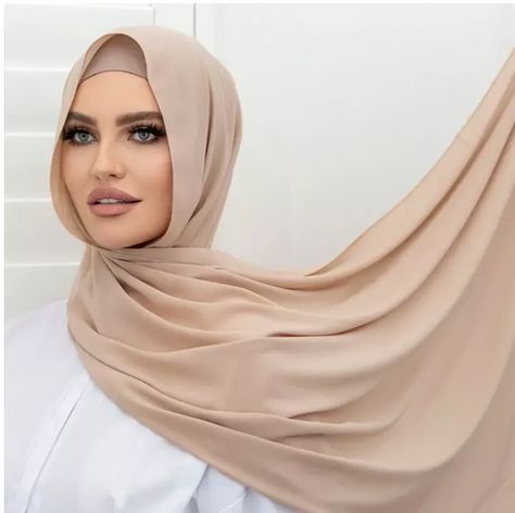 "Effortless Elegance ✨ Embrace timeless style with our Chiffon Long Hijab/Scarf in stunning beige. Its lightweight and breathable fabric ensures comfort throughout the day. Pair it with your favorite outfit for a chic and modest look. 😍 #ChiffonLongHijab #BeigeScarf #ModestFashion #HijabStyle #TimelessElegance" Beige Hijab, Long Hijab, Modest Outfits Muslim, Outfits Muslim, Beige Scarf, Modern Hijab, Tan Face, Style Hijab, Hijab Scarf