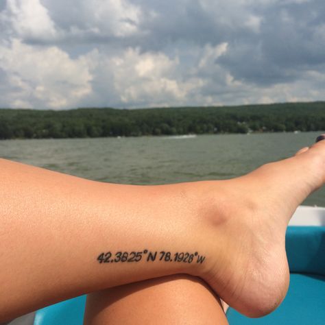 Longitude latitude tattoo of Rushford Lake Coordinates Tattoo Placement Ankle, Small Lake Tattoo, Lake Inspired Tattoo, Longitude Latitude Tattoo, Beach Coordinates Tattoo, Lake Tatoos, Latitude And Longitude Tattoo, Lake Tattoo Simple, Latitude Tattoo