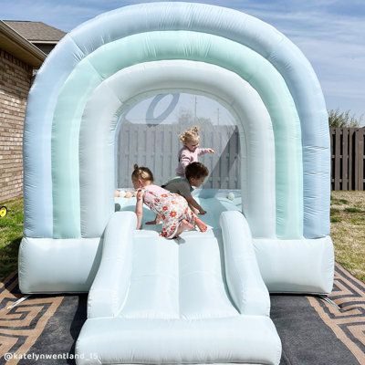 Our best selling DayDreamer bounce house is now available in the Mist colour! The aesthetically pleasing palette looks great in all homes and inspires a dreamy play time for adventurous kids. The added basket ball hoop provides an additional activity, perfect for indoor or outdoor use. This beautiful bounce house will be a hit at kids parties! It comes with matching trendy pastel toned accessories to complete the look. | Bounceland Daydreamer Mist Bounce House blue/Green/indigo 86.4 x 80.4 x 106 Neutral Bounce House, Modern Bounce House, Teal Pastel, Bounce House With Slide, Moon Bounce, Indoor Playroom, Mist Color, Bubble House, Inflatable Bounce House