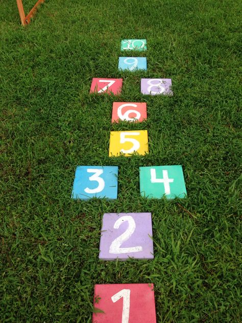 Paving stone hopscotch. I dug out the ground and laid the pavers so no stubbed toes Small Garden Play Area Ideas, Sustainable Playground, Garden Play Area Ideas, Garden Play Area, Play Area Ideas, Diy Pathway, Kids Outdoor Playground, Preschool Designs, Kids Backyard Playground