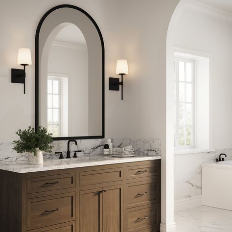 The Blake Vanity Collection references a classic silhouette paired with a modern, sleek finish in distinctive matte black. Versatile and stylish, this transitional wall sconce makes a wonderful addition to your primary bathroom vanity and adds sophistication to your powder room. Featuring a slim arm mounted to a square backplate, supporting a beautiful frosted glass shade, this 16” tall wall light provides soft illumination for your room. The Blake is also available in a coordinating 24" 3 light Matte Black Bathroom Accessories Decor, Bathroom Black Finishes, Guest Bathroom With Black Fixtures, Bathroom Black Light Fixtures, Matte Black And White Bathroom, Neutral Moody Bathroom, Bathroom Mirror And Sconces, Home Decor Black Accents, Organic Modern Half Bath