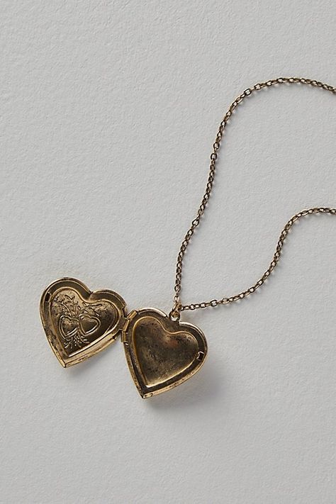 A super sweet gift or an accessory unique to you, this darling monogram necklace features a heart locket pendant with an initial engraving. **Features:** Dainty chain, heart locket pendant, hinge opening mechanism, monogram initial engraving, clasp closure **Why We | Monogram Necklace by Free People in Gold Small Gem Necklace, Heart Locket Necklace Gold, Gold Heart Shaped Locket, Meaningful Goodbye Gifts, Good Heart Necklace, Handmade Unique Jewelry, Initial Necklace H, Dainty Gold Locket, Heart Locket Necklace Picture