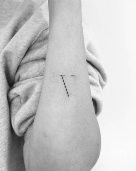 Minimalistic letter "V" tattoo for her son. V Letter Tattoo Designs For Women, V Tatoos Letter, Small V Tattoo, V In Different Fonts, Minimalist Initial Tattoo, V Initial Tattoo, X Tattoo Letter, Letter V Tattoo Ideas, V Tattoo Letter Design