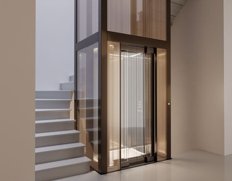 Stairs Lift Design, Stairs With Elevator Design, Stairs With Lift, Glass Elevator Design, Glass Elevator Design Interiors, Lift Design Interior, Hotel Lift Lobby, Lobby Residential, House Elevator