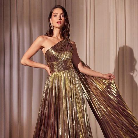 Step Into The Spotlight And Dazzle The Crowd In Our Metallic Lame' Long One Shoulder A-Line Dress. The Luxurious Fabric Shimmers With Every Movement, Making You The Center Of Attention At Any Event. The One Shoulder Neckline Adds A Touch Of Elegance, While The Sleeveless Design Keeps You Cool And Comfortable. Fabric: Metallic Lame’ Length: Long Color: Gold Neckline: One Shoulder Silhouette: A-Line Sleeve: Sleeveless Back: Zipper Skirt: Pleated Embellishments: Side Cape Occasion: Romantic Date/Ev White Rehearsal Dress, Metallic Prom Dresses, Dama Dresses, Cinderella Divine, Radiate Confidence, Dress Asymmetrical, Cinderella Dresses, Inner Goddess, Illusion Dress