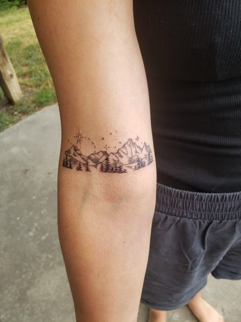 Mountain Tattoo Above Elbow, Olympic Mountains Tattoo, Wyoming Mountain Tattoo, White Mountains Tattoo, Elegant Mountain Tattoo, Mountain Bracelet Tattoo, Mountain Aesthetic Tattoo, Mountain Bicep Tattoo, Mountain Wildflower Tattoo