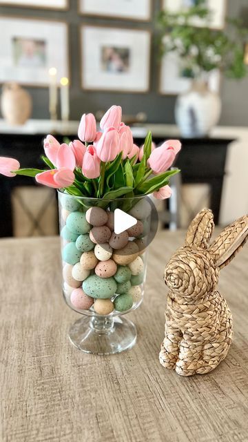 Nicole Chatham • Home Decor on Instagram: "Easy DIY Easter vase!  Comment SHOP for links to everything I used here! 🌷 

This glass hurricane is so perfect for creating different centerpieces year round!  The quality is so good and the price is 👌. I used my favorite Amazon tulips in pink 💗 and paired them with these pretty speckled Easter eggs. And how cute is this little rattan bunny? 🐰 

Have you started putting out any Easter decor yet?  I can’t believe it’s only a month away! 

FOLLOW @life.on.chatham.lane for more styling ideas ✨

TO SHOP THIS POST:

✨Comment SHOP for a direct link to be sent to your DMs

✨Click on the link in my bio “Shop my home and favs”

✨✨Direct link to shop: https://liketk.it/4yLhs✨✨

#neutralhome #ltkhome #cozyhome #homedecor #interiordesign #affordabledecor Easter Vase, Easter Centerpieces Diy, Tulips In Vase, Plastic Eggs, Easter Centerpieces, Affordable Decor, Transitional House, Diy Vase, Diy Easter