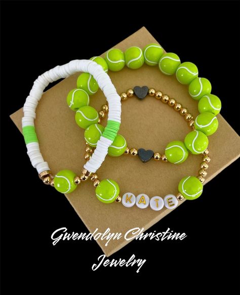 My tennis  Stretchy bracelets are fun and fashionable for the the proud tennis mama  or the tennis athlete.  Personalize your stack with your  name and number. Buy 1 bracelet or stack all 3.. bracelets will come as seen in picture unless you specify different colors at checkout in personalization section  My bracelets are custom made with very durable stretchy jewelry cording.  This listing is for 1  or all 3 bracelets made. Please indicate preference at checkout along with personalized information in personalization section ➡️ I can also make bracelets with silver beads as well just indicate that in the personalization section Also if you would like custom colors send me a message and I will do my best to accommodate you!  otherwise, bracelet will come in the white and green  ❤️Sizing det Tennis Bracelet Ideas, Diy Tennis Bracelet, Sports Bracelets Diy, Tennis Senior Night, Tennis Wristband, Tennis Athlete, Tennis Gift Ideas, Tennis Crafts, Tennis Lifestyle