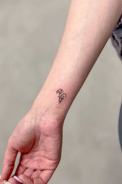 30 Aries Tattoo Ideas & Designs Daisy And Aries Tattoo, Aries Tattoo For Women Small, Fire Aries Tattoo, Aries Aquarius Tattoo, Aries Element Tattoo, Aries Wrist Tattoo, Subtle Aries Tattoo, Aris Tattoos Zodiac Signs, Aries Tattoo Ideas Unique Women