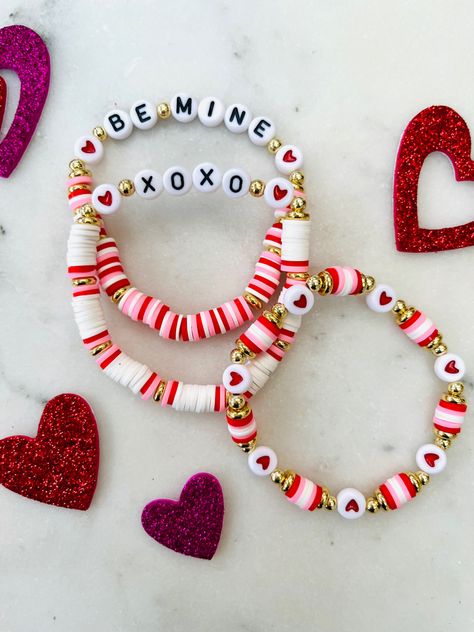 Be Mine, Valentine! Order your set today! ❤️ Clay Beads Valentines, Valentines Bracelets Ideas, Cute Valentines Bracelets, Valentine’s Day Clay Bracelets, Valentine Clay Bracelets, Valentine’s Bracelets, Valentine Day Bracelets, Valentine Heishi Bracelets, Valentine’s Day Friendship Bracelet