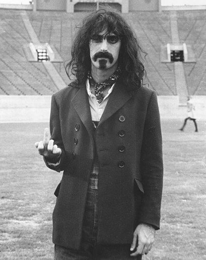 Frank Zappa (1970) Is he flipping you off? Or practicing guitar chords? (He's flipping you off.) Frank Vincent, Frank Zappa, Real People, Famous People, Rock N Roll, The Middle, Rock And Roll, Gq, Rocker