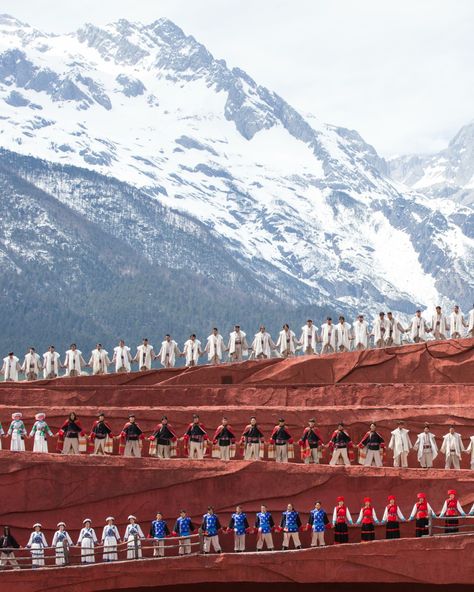 The mighty Jade Dragon Snow Mountain dominates the landscape, watching over Lijiang Old Town and Lion Hill, from which Amandayan makes its home. It also serves as the setting for Impression Lijiang, a spectacular show created by Zhang Yimou, director of the opening and closing ceremonies for the 2008 Beijing Olympics. In the open air of this vast outdoor theatre, the local Naki community perform mesmerising dances and songs from their local folklore. Outdoor Theatre, Beijing Olympics, Lijiang, Glacier Park, Outdoor Theater, Jade Dragon, Snow Mountain, Round Trip, The Mighty