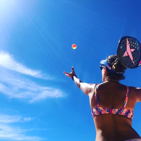 Serving in a sunny day with a blue sky back ground. Young lady with a Dropshot Beach Tennis racket. Beach Tennis Aesthetic, Surf Photoshoot, Tennis Photoshoot, Tennis Serve, Tennis Aesthetic, Beach Tennis, Surfers Paradise, Beach Ball, Summer Sports