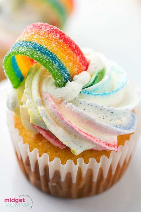 Rainbow cupcakes are an easy St. Patrick's Day recipe that can be whipped up just in time for dessert! Fresh baked cupcakes with homemade rainbow frosting and topped with a rainbow candy strip. Rainbow Cupcake Cake, Angel Food Cake Cupcakes, Rainbow Swirl Cake, Rainbow Icing, Rainbow Baking, Almond Cupcakes, Rainbow Desserts, Rainbow Frosting, Rainbow Cupcake