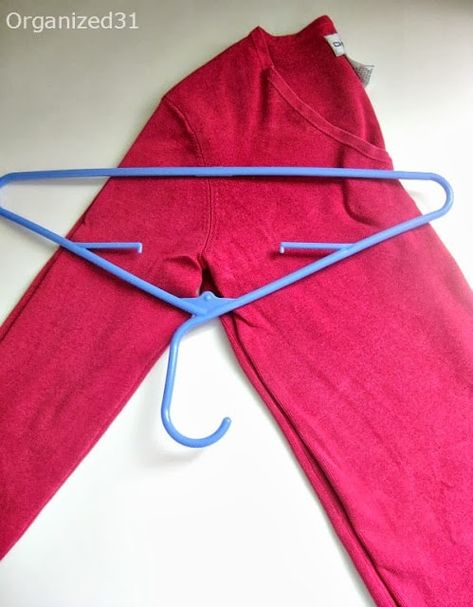 Organized 31 - How to Best Hang Your Sweaters Shirt Folding Trick, How To Fold Sweaters, Sweater Hangers, Hang Sweaters, Sweater Organization, Sweater Hanging, T Shirt Folding, Bulky Sweaters, Packing Hacks Clothes