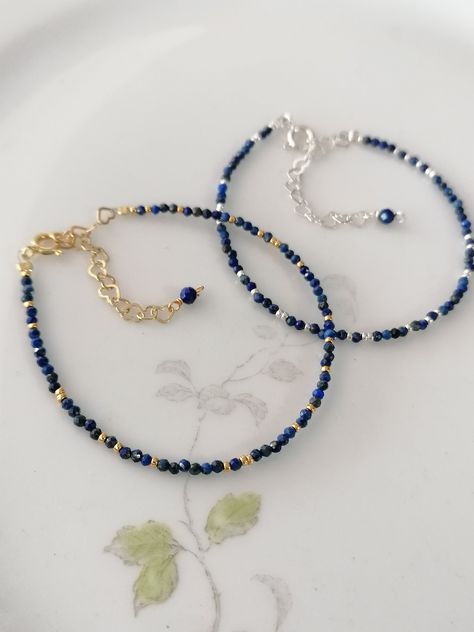 The elegant, delicate bracelet made of faceted lapis lazuli beads shines in a wonderful dark blue. It's so discreet that it can be easily combined with other bracelets. E.g. with the PureStyle bracelet: https://www.etsy.com/de/listing/1039022960/armband-zart-miyukiperlen-filigran-24kt ✨ Lapis lazuli is considered a powerful tool for spiritual development and self-healing. The bracelets fit wrists from approximately 15 cm to 19 cm, as they are adjustable in size with an extension chain made of he Dark Blue Beaded Bracelet, Self Made Bracelets, Dark Blue Bracelet, Blue Bracelets, Lapis Lazuli Blue, Blue Pearls, Blue Beaded Bracelets, Lapis Lazuli Beads, Lapis Lazuli Gemstone