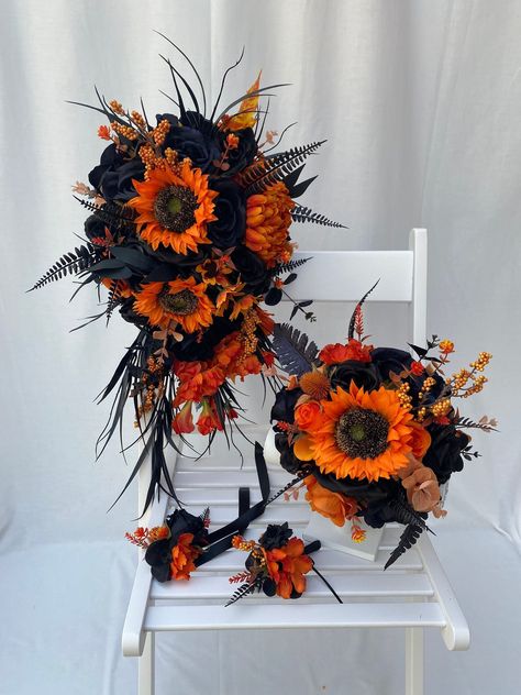 Custom Realistic Artificial Gothic Black Orange Cascading Wedding Bouquet This stunning bouquet has been custom made with quality silk & real touch flowers. The bouquet handle has been hand wrapped with black jute twine.  This bouquet is approximately 18 x 12 inches (45 x 30cm) The matching buttonhole has also been made with silk & real touch flowers & all buttonholes come with integral pin attached. These bouquets are also available in another listing in our shop Bridal bouquet - 10 inches diameter Corsages Gothic Sunflower Bouquet, Dark Sunflower Bouquet, Black Red And Orange Wedding, Orange And Black Wedding Theme, Black And Orange Wedding Theme, Orange Sunflower Bouquet, Halloween Wedding Colors, Werewolf Wedding, Burgundy And Burnt Orange Wedding