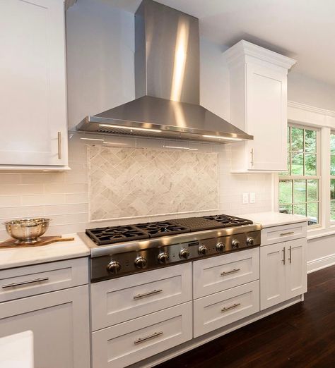 Sleek, stainless steel hoods are a great modern or classic design choice. The industrial feel and clean lines work well with contemporary kitchens, while the metallic element adds contrast and a modern touch to traditional kitchen décor. Click on the link to see photos of more kitchen vent hood ideas. https://www.kbconstructionnj.com/kitchen-vent-hood-designs-images-and-ideas/ Modern Kitchen Stove, Kitchen Stove Design, Stainless Steel Hood Vent, Traditional Kitchen Decor, Kitchen Hood Ideas, Stove Range Hood, Stove Design, Home Ideas Kitchen, Kitchen Hood Design