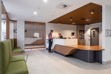 University Reception, Hospital Concept, Hybrid Office, Hospital Reception, Woods Bagot, Medical Furniture, Hospital Health, Wood Seating, New Hospital