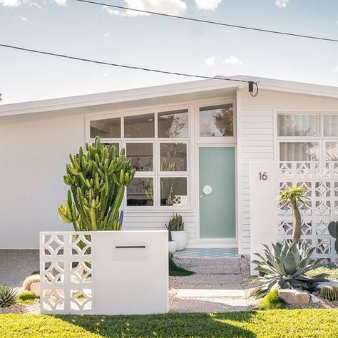 Adore Home Magazine on Instagram: "This is definitely my favourite before and after of my home - our front exterior and landscaping went through a big makeover. Here’s what we did:

- Reclad the front in brand new @jameshardieau Axon cladding and Linea weatherboards (it was previously clad in vinyl cladding with asbestos cladding underneath it)
- Replaced front door
- Restored the right hand side windows and replaced the left hand side windows with replica ones (due to a structural beam that had to go in the living room).
- Brand new driveway, steppers and concrete pad for our courtyard
- Built @thebreezeblockco privacy wall and custom built in @milkcanoutdoor letterbox 
- Re-tiled the front porch
- New plants! 

Fun fact, a previous home owner in the 90s hand made all of those hexagon pav Hexagon Pavers, Axon Cladding, Palm Springs Exterior, Palm Springs Garden, Vinyl Cladding, Palm Springs Homes, Palm Springs House, California Beach House, Palm Springs Home