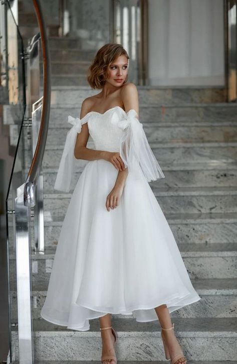 Midi wedding dress| tea length wedding dress | minimalist bridal gown | boho bridal dress | romantic wedding dress| simple wedding dress Modest and simple short wedding dress yet full of flirt and elegance. This midi wedding dress has a corset-like bodice with built-in cups with the lacing up at the back and it fits perfectly to your beautiful figure. If you are old-school, you will love this 60s style bridal gown with fluttering organza skirt with a few layers of tulle for an extra volume. Midi Wedding Dress Lace, Midi Wedding Dress Tea Length, Cup Wedding Dress, Minimalist Bridal Gown, Midi Bridal Dress, Modern Short Wedding Dress, Wedding Dress Tea Length, Wedding Dress Minimalist, Simple Wedding Dress Short