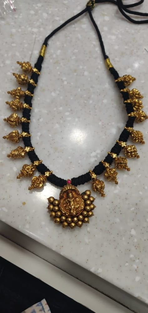 Antique nagar pendant and kaai Maalai in black thread Thread Jewellery Gold, Temple Earrings Gold Jewelry, Black Thread Jewellery Indian, Black Thread Gold Jewellery, Gold Beds, Black Thread Necklace, Pearl Earrings Designs, Temple Jewellery Earrings, Temple Jewelry Necklace