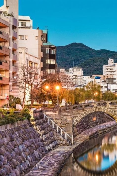 The ultimate guide to Nagasaki, full of the best things to do in Nagasaki in two days. From must-see attractions to where to enjoy the city's famous cuisine. Nagasaki Aesthetic, Nagasaki Japan, Japanese Wallpaper, Arch Bridge, Stone Arch, Old Bridge, Chinese Architecture, Nagasaki, National Treasure