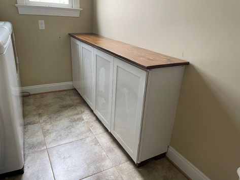 Transform a space with wall cabinets used as base cabinets and sofa feet. Looks custom! Shallow Base Cabinets, Upper Cabinets Used As Base, Using Top Cabinets As Base Cabinets, Laundry Room Base Cabinets, 12 In Cabinet Ideas, Top Cabinets As Base Cabinets, Using Wall Cabinets As Base Cabinets, Using Upper Cabinets As Base, Lower Cabinets Only