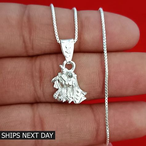 Silver Radha Krishna Pendant, Hindu God Pendant with Chain for Men and Women Everyday Necklace ➤ PRODUCT DETAILS ✦ Item Code:--------- GJP-1187 ✦ Item Weight:------- 1.50 grams (Approx.) ✦ Metal:---------------- Pure Silver ✦Item Dimension (L x W ) 2.10 x 1.20 cm (Approx.) ✦Chain Length 18" Inch, Weight 2.80 grams Note:- All the items appear larger than actual in size so please check measurements carefully before purchase. THIS PRODUCT CAN BE GIFTED ON THE FOLLOWING OCCASIONS:- Birthday Gift, An Radha Krishna Pendant, Krishna Pendant, God Pendant, Friendship Day Gifts, Necklace Product, Chain For Men, Wedding Pendant, Jewelry Lockets, Star Chain