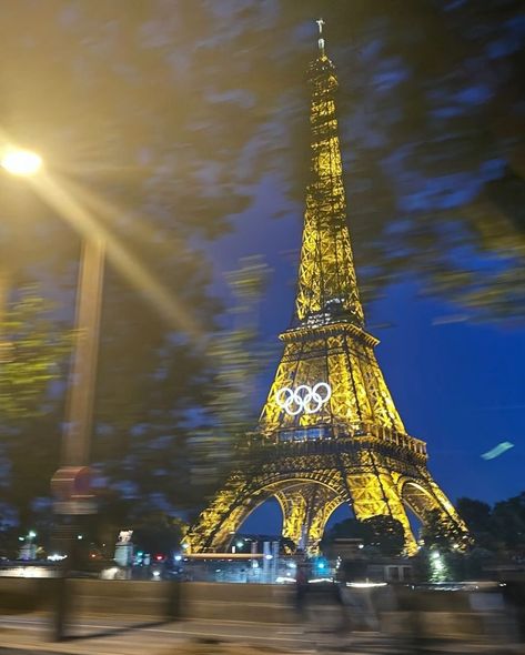 the olympic rings have been installed on the eiffel tower for the paris olympics, adding a stunning new look to the iconic landmark. these rings symbolize the unity and spirit of the games as paris prepares to host athletes from around the world. - #parisolympics #eiffeltower #olympicrings #paris2024 #olympics #cityoflights #sportingevent #iconiclandmark #paris #historyinthemaking #flawdforge Olympic Rings Aesthetic, Eiffel Tower Olympics, Olympics Aesthetic Paris 2024, The Eiffel Tower Aesthetic, Olympics Paris 2024, Olympics 2024 Paris, Travel Around The World Aesthetic, Paris 2024 Olympic Games, Olympic Aesthetic