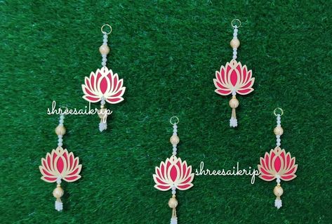 Lotus Hanging for Diwali Decoration | Lotus Backdrop Hanging | Temple Decor Door Hanging Material: Plastic, Beads, MDF Wood  Size: Item Dimensions 5 x 4 inches Color: Red, Pink, Yellow, White, Green, Assorted  Please contact/ Message us in case of any confusion or any question +91 8306025314 Whatsapp available Elevate your festive decor with our exquisite Lotus Hanging, designed to add a touch of spiritual elegance to your celebrations. Perfect for Diwali, Navratri, or temple decor, this handmade piece embodies the beauty and symbolism of the lotus flower. Premium Quality: Our lotus hanging is crafted with meticulous attention to detail. Each petal is carefully shaped, and the materials used are of the highest quality to ensure longevity and durability. NOTE: Please Drop Us A Message If Yo Hanging For Diwali Decoration, Navratri Decor, Lotus Hanging, Temple Decor, Backdrop Decor, Diwali Decoration, Festive Decor, Diwali Decorations, Wood Sizes