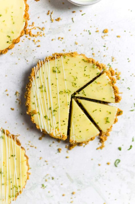 These mini key lime pies are so easy to make. They have a graham cracker crust, and a tangy creamy filling. They are so versatile and can be made into bars or a large pie. Delicious and refreshing, these mini pies are the perfect dessert any time of the year! #easykeylimepie #keylimepierecipe #howtodecoratekeylimepie #decoratepie #keylimepie #frostingandfettuccine Authentic Key Lime Pie Recipe, Key Lime Pies, Mini Key Lime Pies, Easy Impressive Dessert, Key Lime Pie Easy, Key Lime Pie Recipe, Favorite Pie Recipes, Lime Pie Recipe, Keylime Pie Recipe