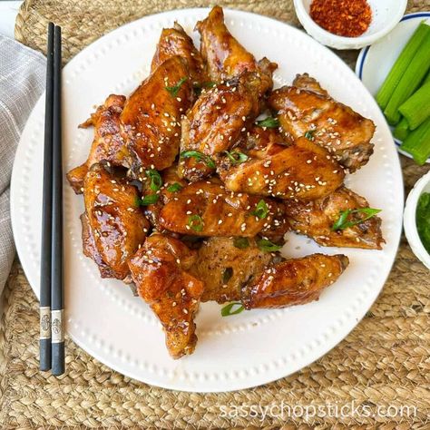 Baked Asian chicken wings are a delicious appetizer or snack that features chicken wings seasoned with Asian flavors and then baked in the oven. These wings typically involve a marinade made with ingredients commonly found in Asian cuisine, such as soy sauce, ginger, garlic, sesame oil, etc. They are a popular choice for those who enjoy the diverse and exciting flavors of Asian cuisine and the classic appeal of chicken wings. Believe me, once baked, they will disappear quickly!  Ingr… Chicken Wings Asian Style, Baked Asian Chicken Wings, Chicken Wing Seasoning, Garlic Ginger Chicken, Asian Chicken Wings, Oven Chicken Wings, Asian Marinade, Frozen Chicken Wings, Baked Wings