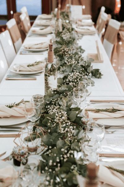 30 Gorgeous Eucalyptus Wedding Decor & More Ideas - Wedding Hacked Eucalyptus Wedding Reception Decor, Floating Candles Long Table Wedding, Boho And Greenery Wedding, Eucalyptus Wedding Florals, White And Green Decor Wedding, Wedding Boho Ideas, Eucalyptus Centerpiece Long Table, Wedding Decorations Green And White, Wedding Ideas Green And White