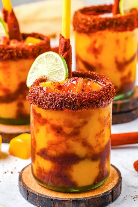 Mexican Candy Mixed Drink, Mangonada Recipe Alcohol, Tajin Smoothie, Mango And Tajin, Drinks With Tajin Rim, Chamoy Drinks Cocktails, Drinks With Tajin, Mango Mixed Drinks, Tamarind Vodka Recipes