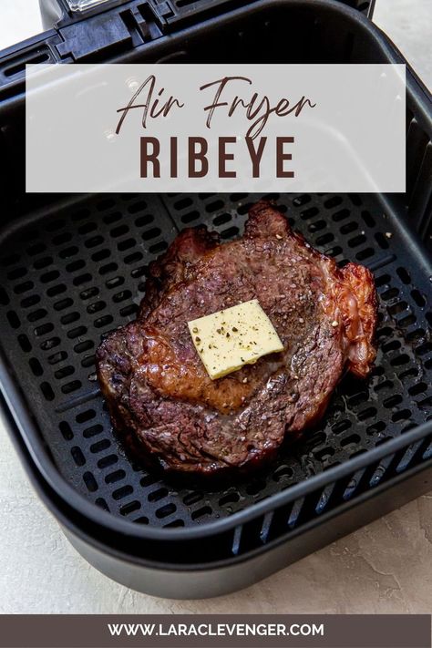 A cooked ribeye in an air fryer basket with butter and salt and pepper on top. Air Fryer Ribeye Steak Medium, Air Fryer Ribeye Steak, Air Fryer Ribeye, Steak In The Air Fryer, Air Fry Steak, New Air Fryer Recipes, Air Fryer Recipes Snacks, Air Fryer Steak, Air Fryer Cooking Times