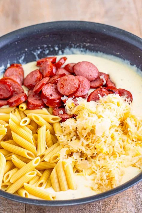 Sauerkraut, sausage, and penne in a cheesy creamy sauce. Polish Casserole, Casserole For Two, Polish Sausage Recipes, Sausage Penne Pasta, Creamy Cheesy Pasta, Kielbasa Pasta, Sausage Penne, Polish Dishes, Game Portal